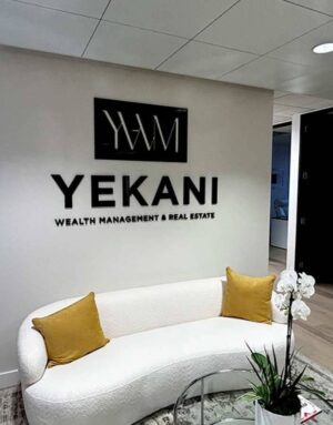 Yekani-Wealth-Management-Real-Estate-3D-sign-on-the-wall_600x765